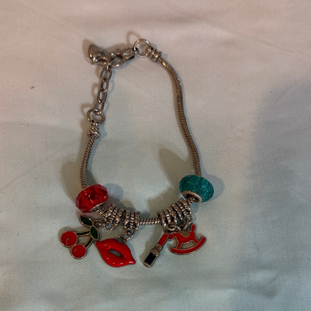Elegant Silver Bracelet with Red and Teal Charms